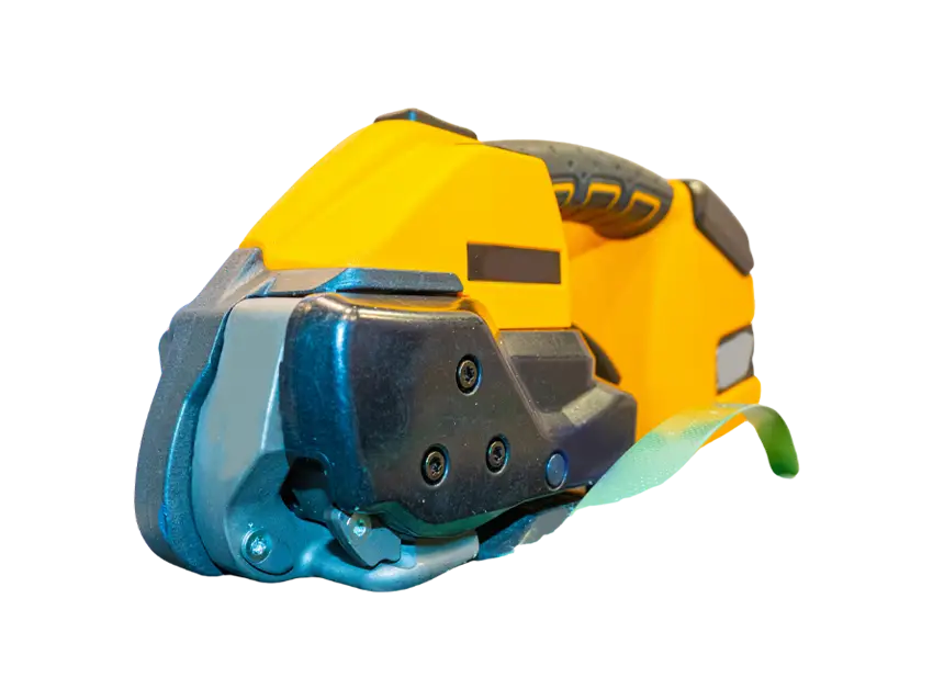 Paletten Warensicherung: Detail of a yellow and black strapping tool for securing goods on pallets. Umreifungsgeraet detail.