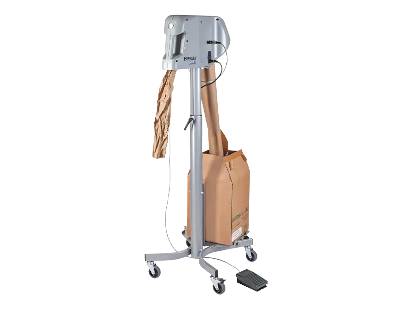 Schutz PAPERplus Shooter Papierpolstermaschine: Maschine produziert Papierpolster für Schutz-Polstersysteme, sauber und effizient.